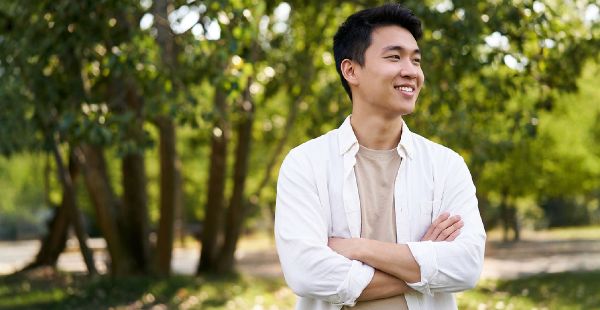 A person feeling hopeful, outdoors in nature